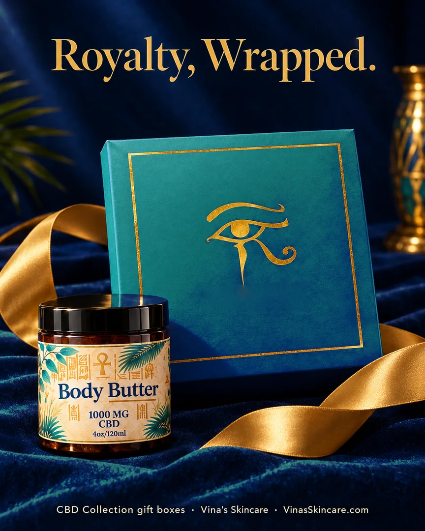 Closed teal Eye of Horus gift box with gold Eye of Horus beside a CBD body butter jar on blue velvet